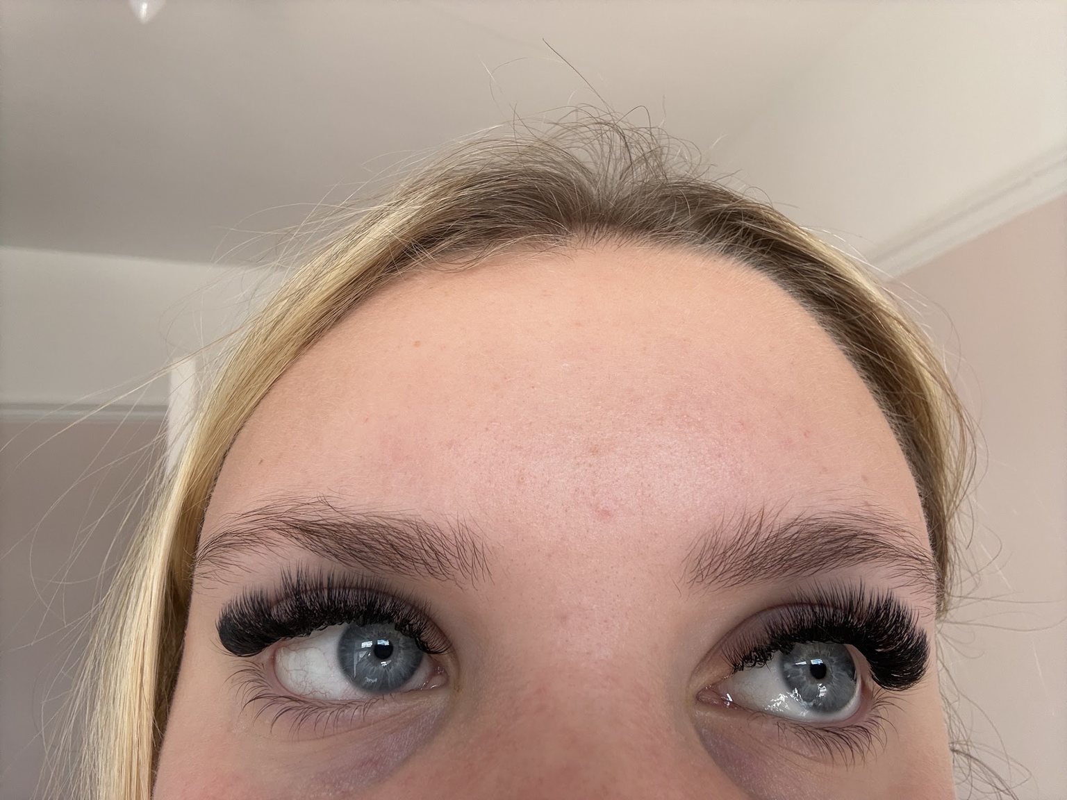A client looking up to show a full, dark volume set