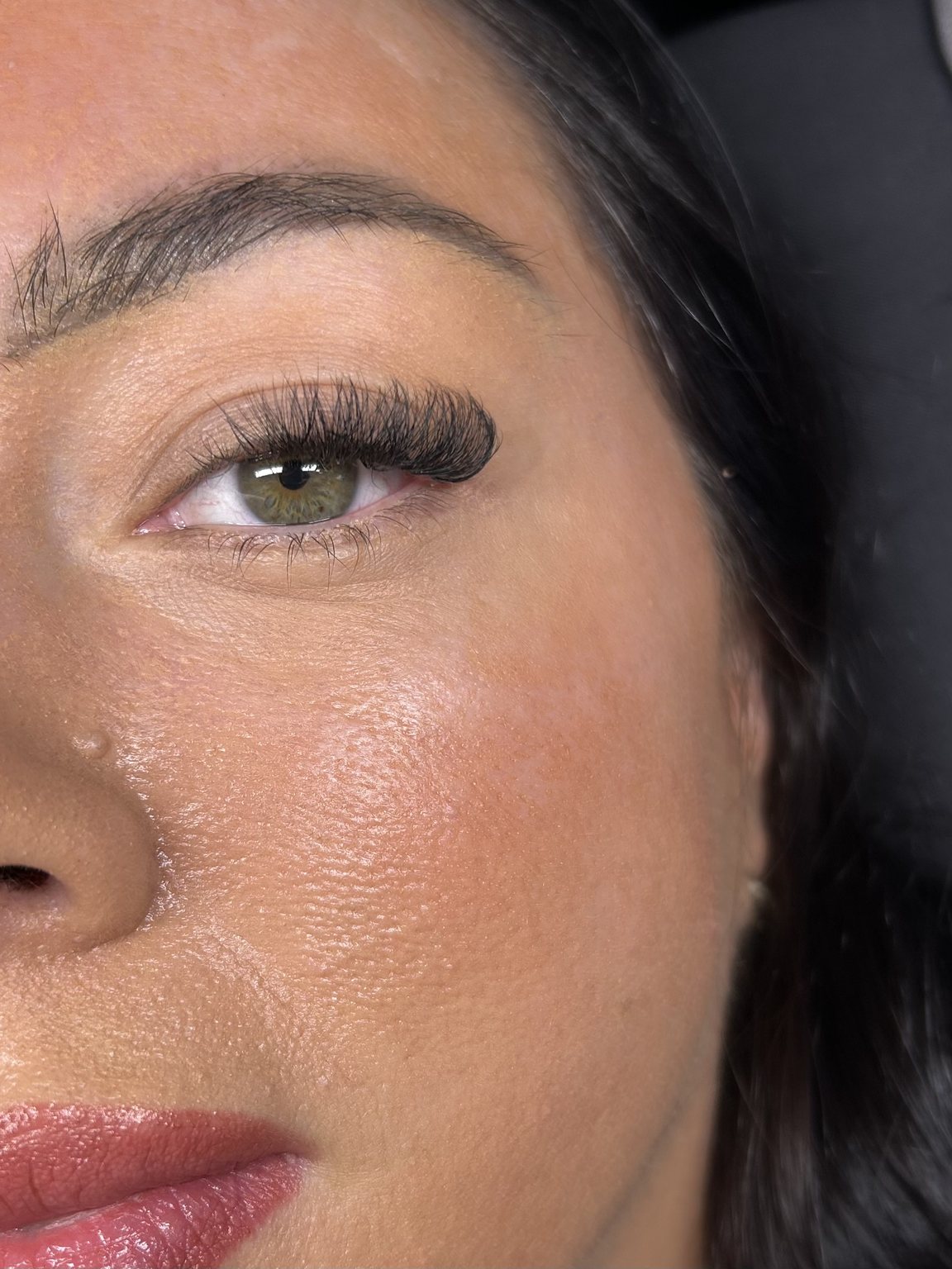 Close-up of a soft volume set on a client with green eyes